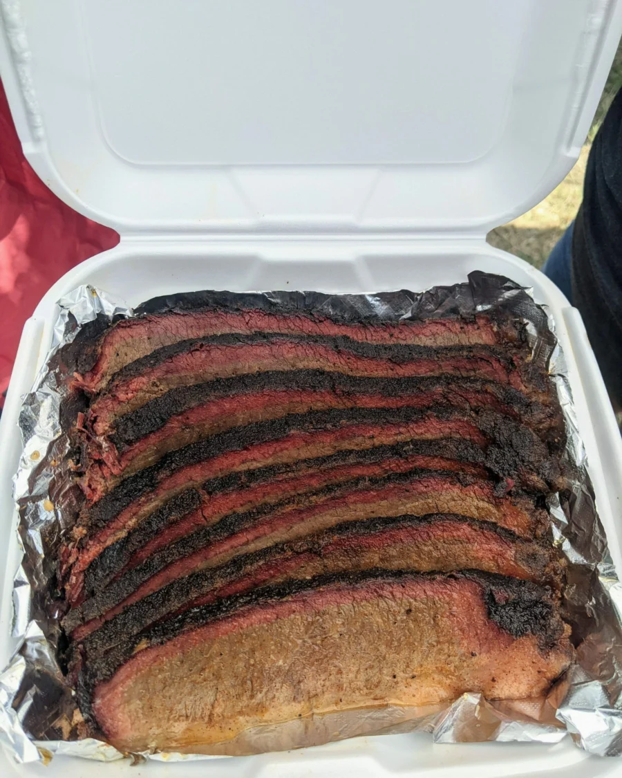 Sliced competition brisket with a deep smoke ring